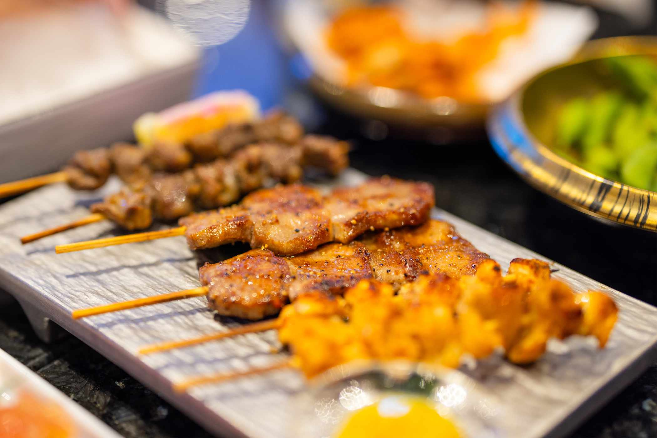 japanese-meat-skewer-in-the-restaurant-XMAXBTU.jpg